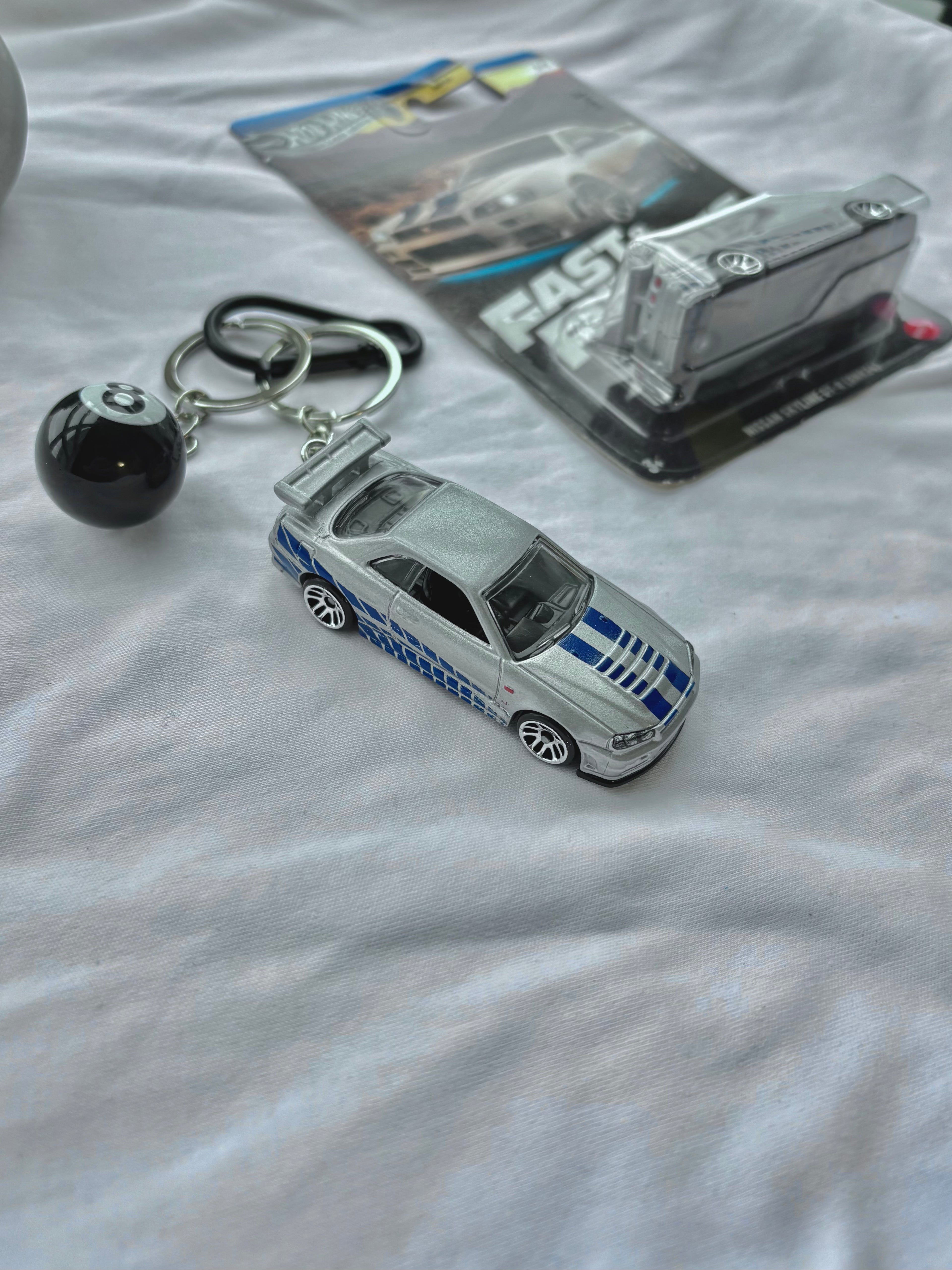 Couple Fast and Furious keychains (Brian's and Suki's)