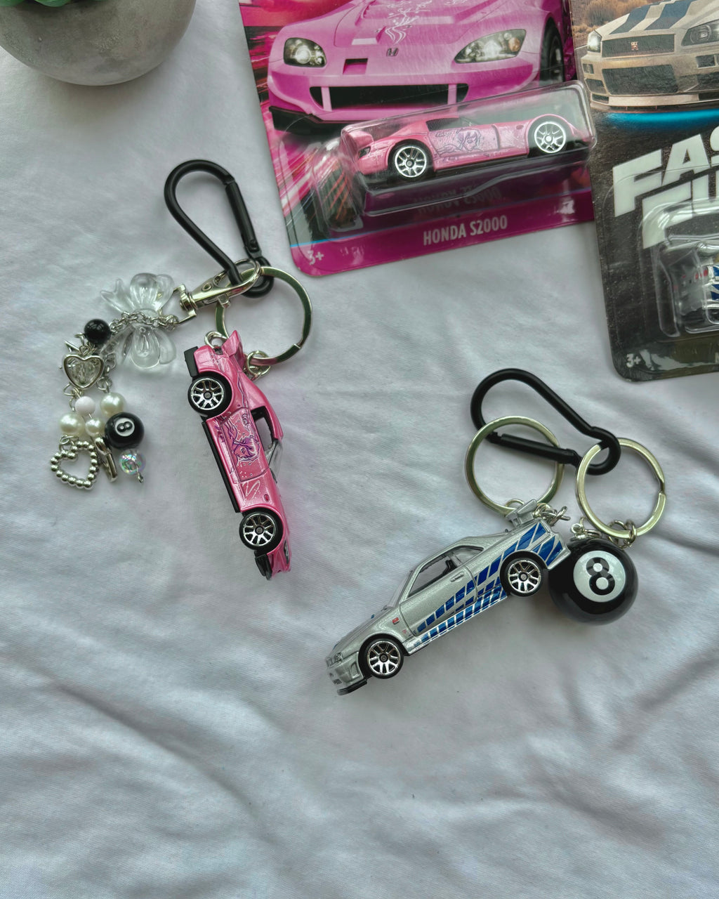 Couple Fast and Furious keychains (Brian's and Suki's)